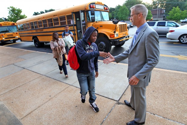 Dr. Knost greets transfer students on the first day of school August 2013. Photo courtesy of stltoday.com