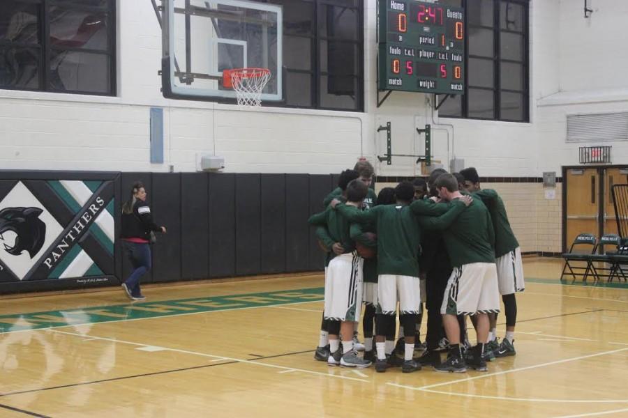 The team huddles before a Dec. 18 win against Windsor.