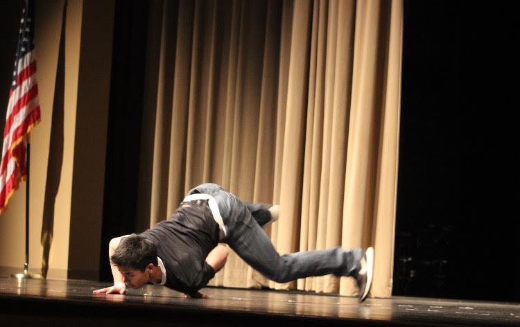 Jake Lam performing a hip hop dance routine . 