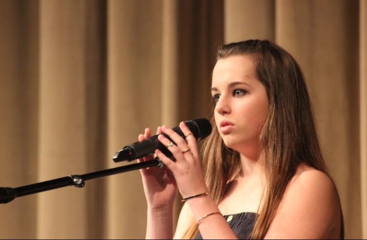 Grace Robertson wows the crowd with her singing performance of "Fly, Fly Away" by Kerry Butler. 