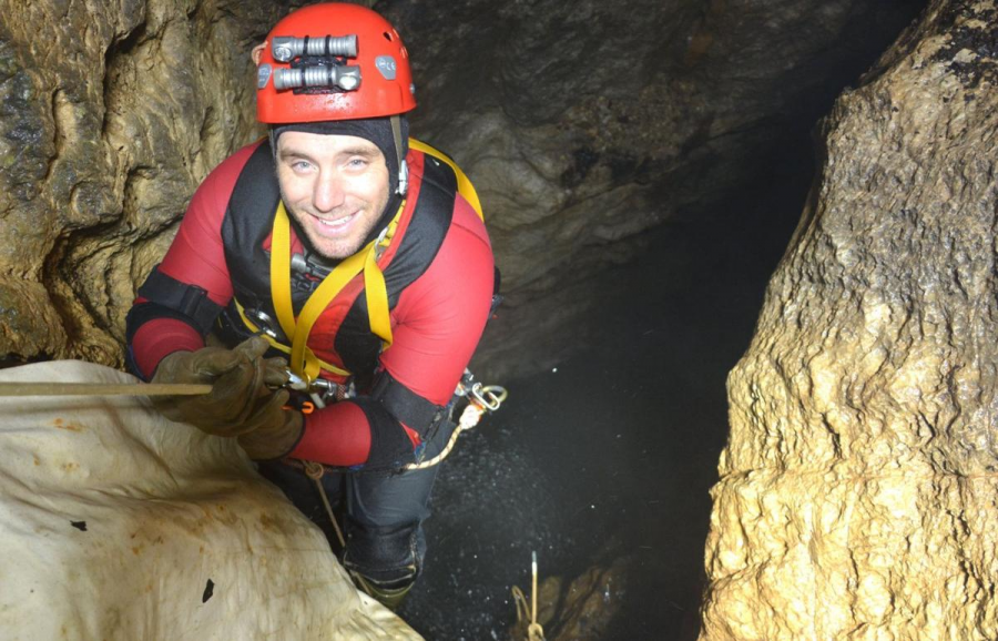 Dan Lamping is pictured using a rope to enter Devils Well, a sinkhole  cave in the state of Missouri. 