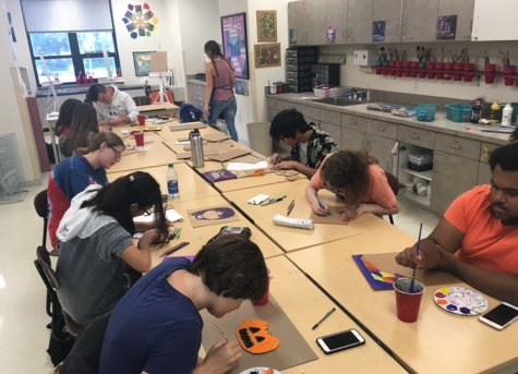 Art Club members create projects after school.