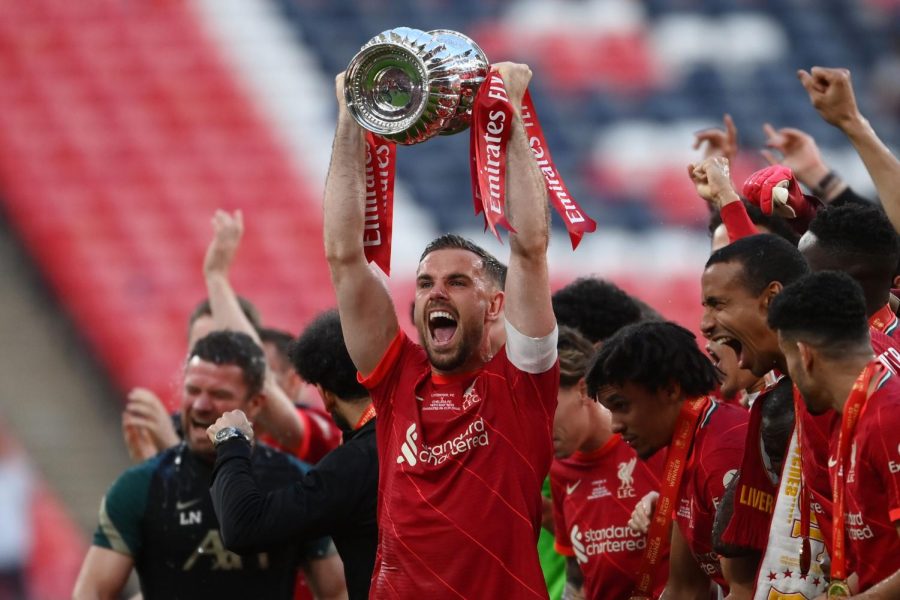 Liverpools Jordan Henderson raises the Emirates FA Cup at Wembley Stadium.
