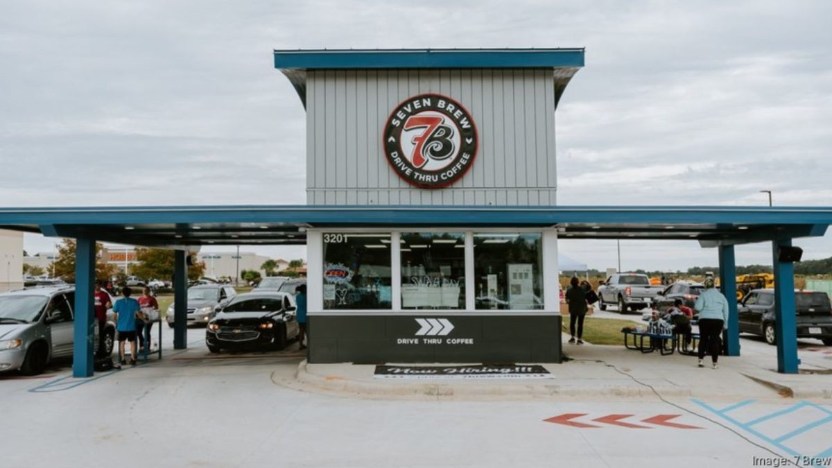 Customers wait outside for the new 7 Brew. 