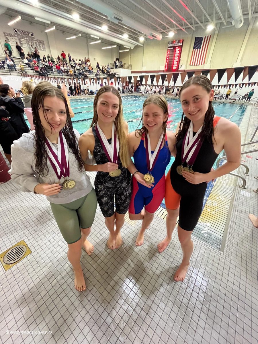 Allison, Kara, Olivia, and Lily celebrating their 2nd place from the 200 free relay.