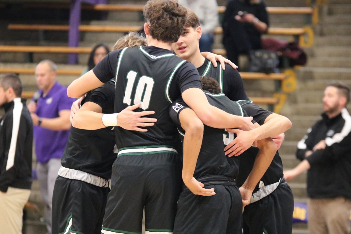 The Varsity team huddling together at half time