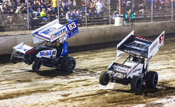 Kyle Larson and James McFadden wheelie to the finish.