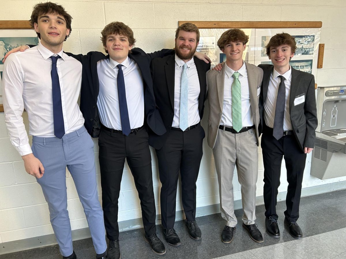 DECA Sponsor Drives Team to Success at Districts 