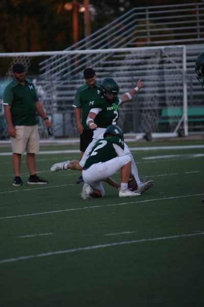 Senior Cliff Storch practices taking a field goal at the Green and White match held on Aug. 20.