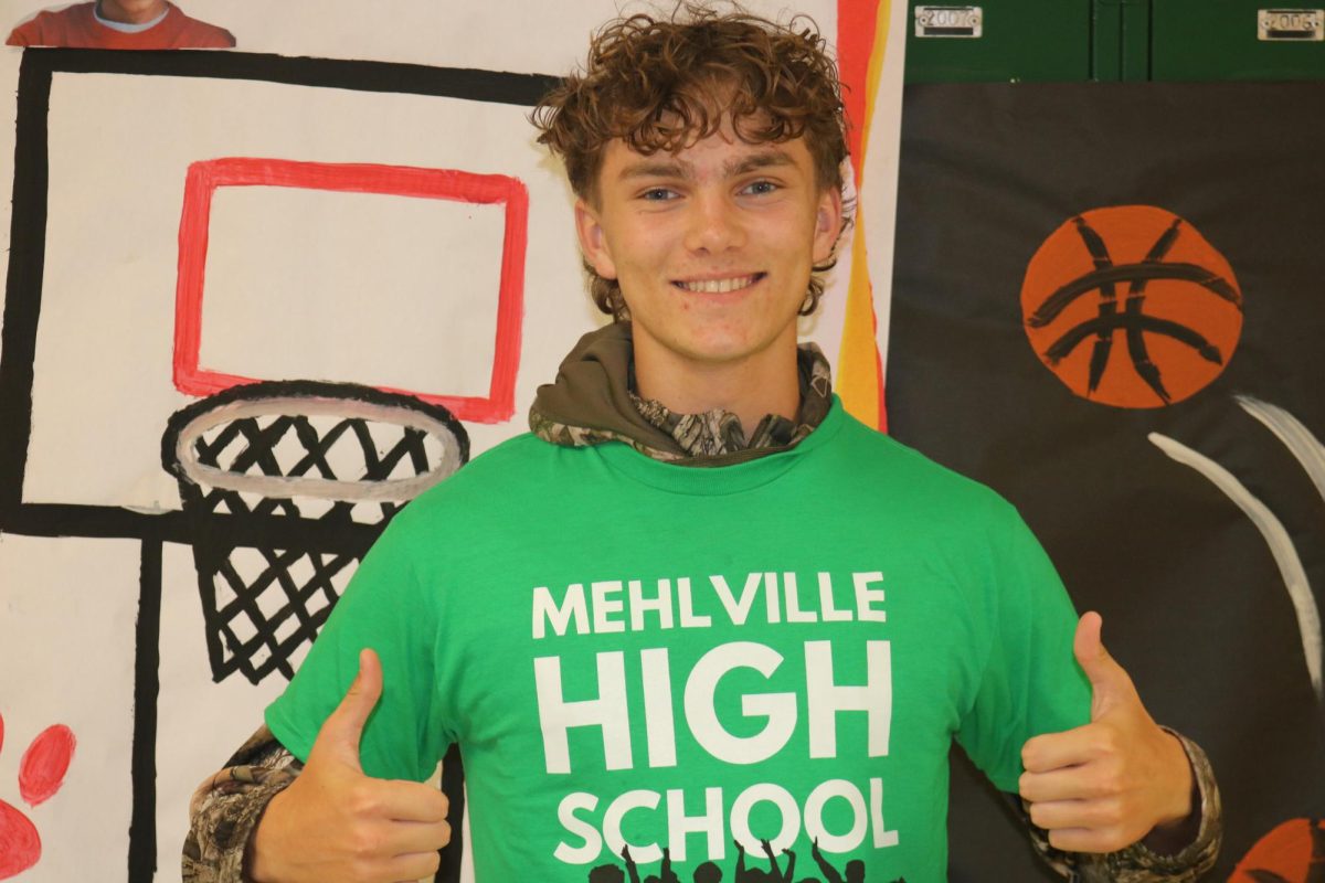 Junior Riley Agnew wearing his HOCO shirt