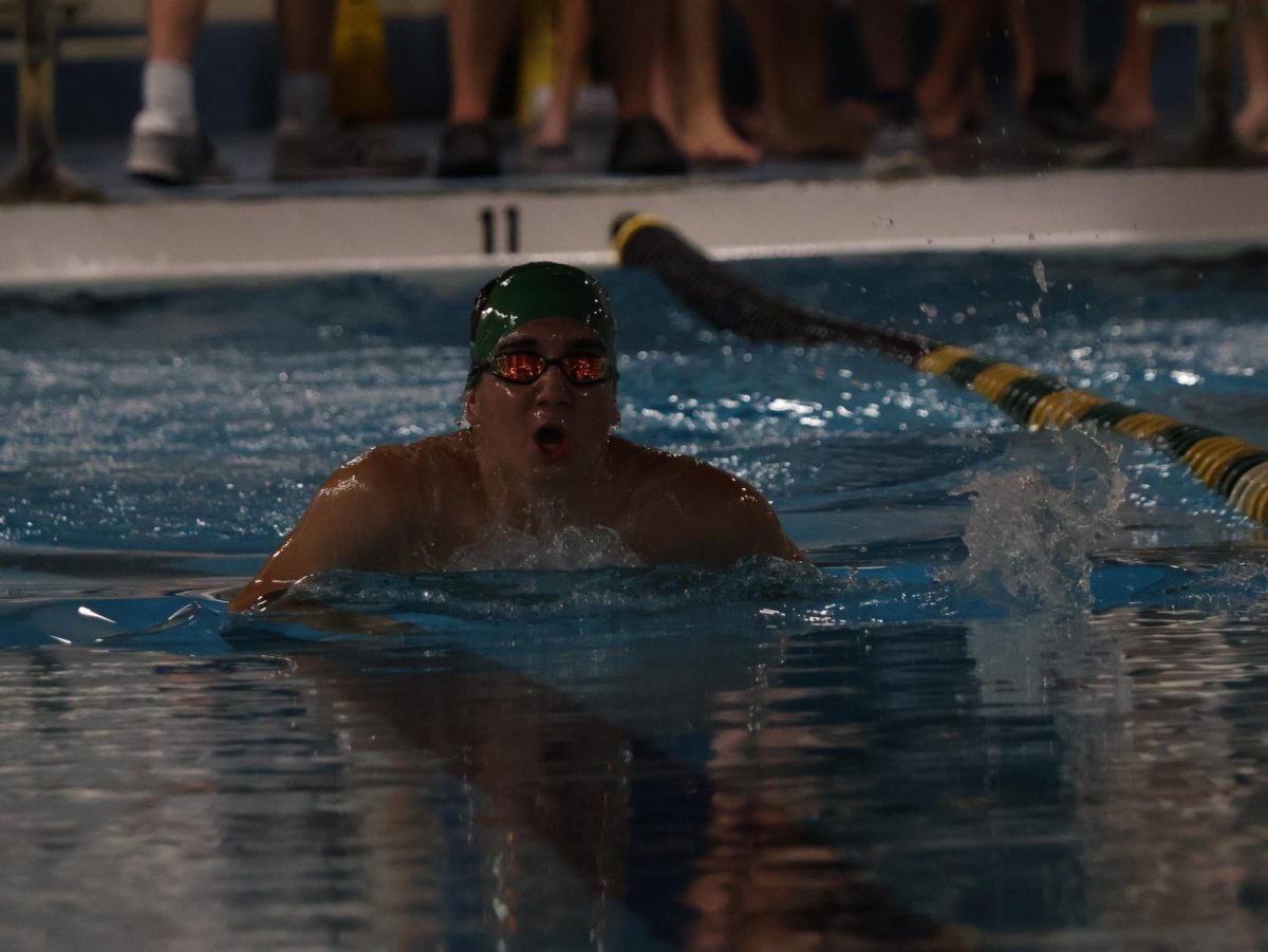 Logan Brotherton (10) competes against Oakville and Vianney.