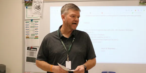 Harper leads his English language arts class in a lesson about "Romeo and Juliet." 
