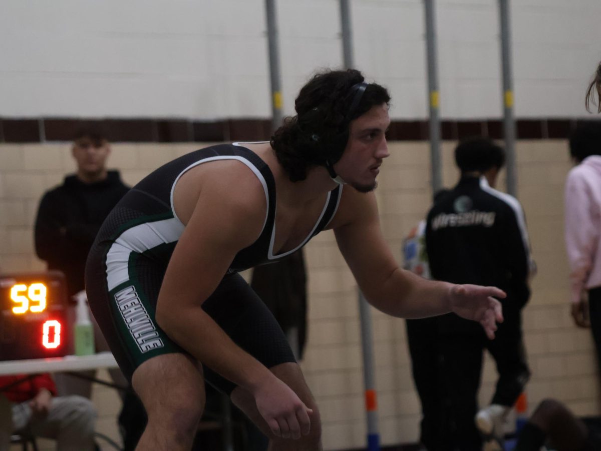 Alen Hasonovic faces off in a wrestling match.