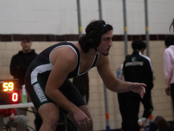 Alen Hasonovic faces off in a wrestling match.