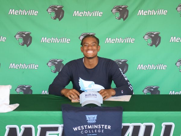 Aaron Davenport signs to play Division III football in college.