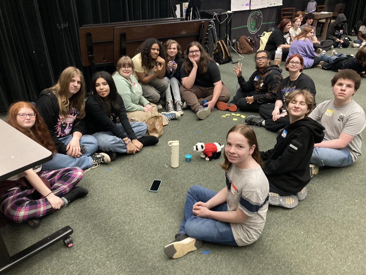 Students play a game at the December  meeting.