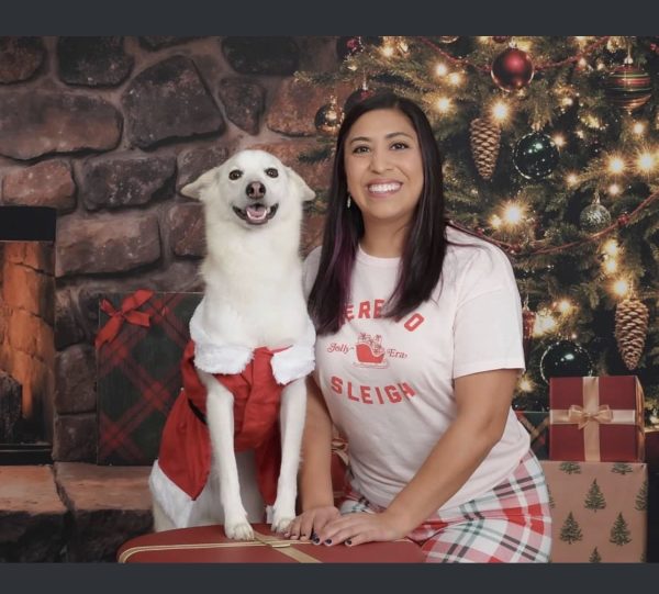 Ochoa poses with her dog for a holiday portrait.