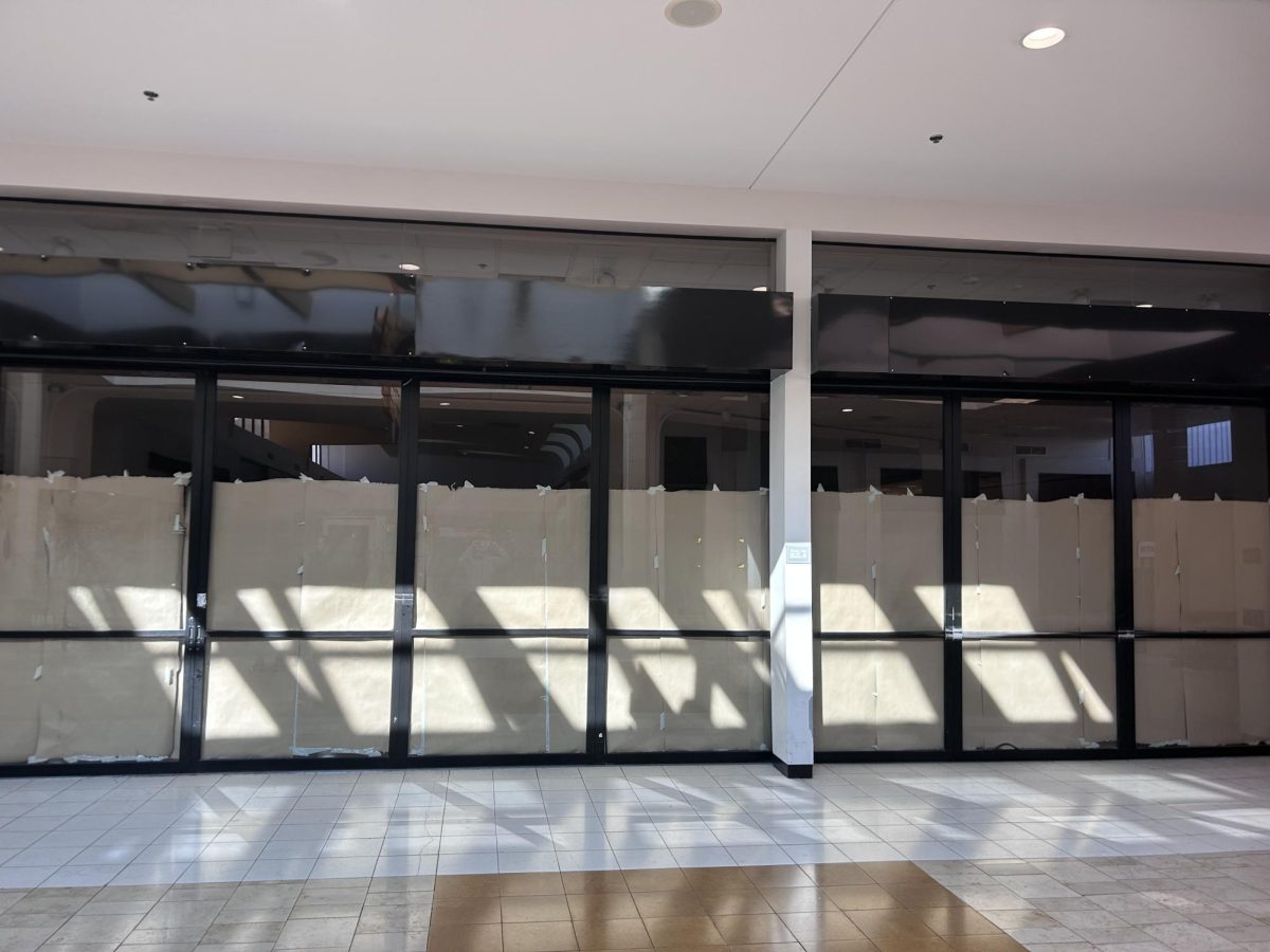 Former Macy's covered with paper after closing down.