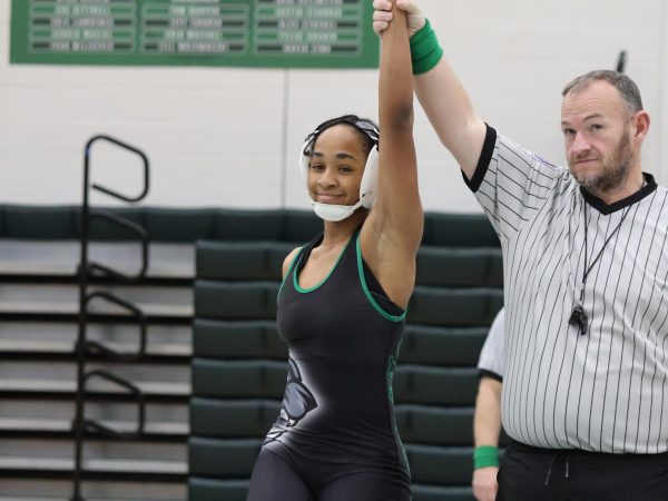Morrow celebrates a win during her season in the Mehlville High School gym.